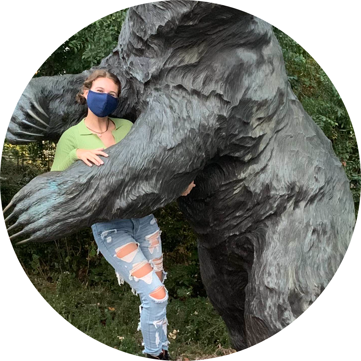 Amanda receiving a Bear hug from a statue
